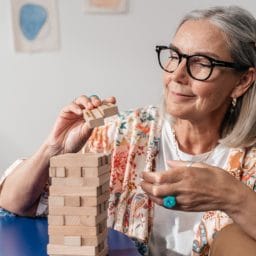 Woman putting together a puzzle.